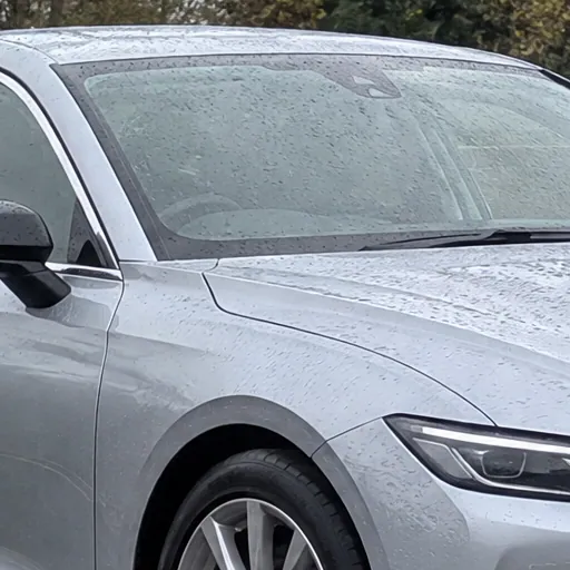 The same windscreen and wing covered in rain drops in the sample lot photo; a sample photo made with TunePixel AI.