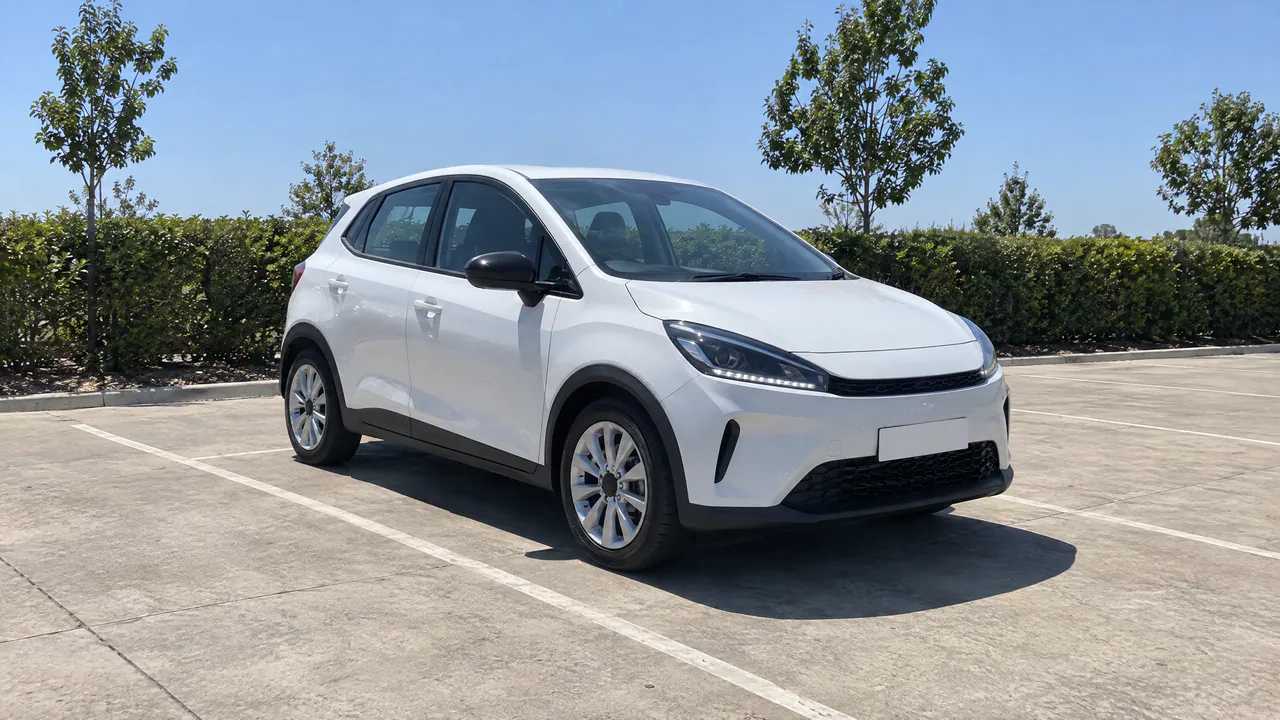 A fictional white hatchback on a sunny car lot with hard midday shadows, front three-quarter view; a sample photo made with TunePixel AI.
