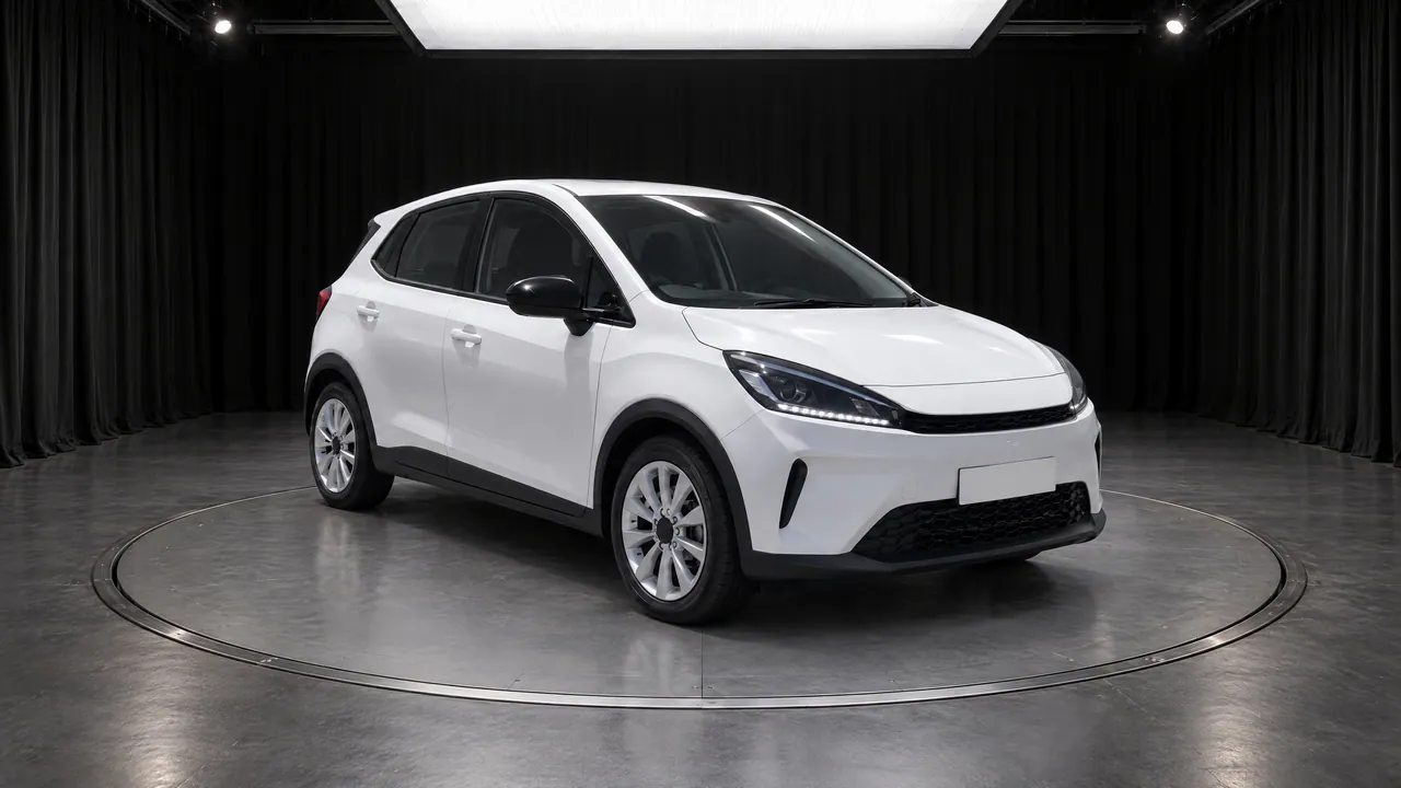 A fictional white compact hatchback on a turntable in the Black Box studio, with black curtains and a grey floor, front three-quarter view; made in TunePixel AI Studio.